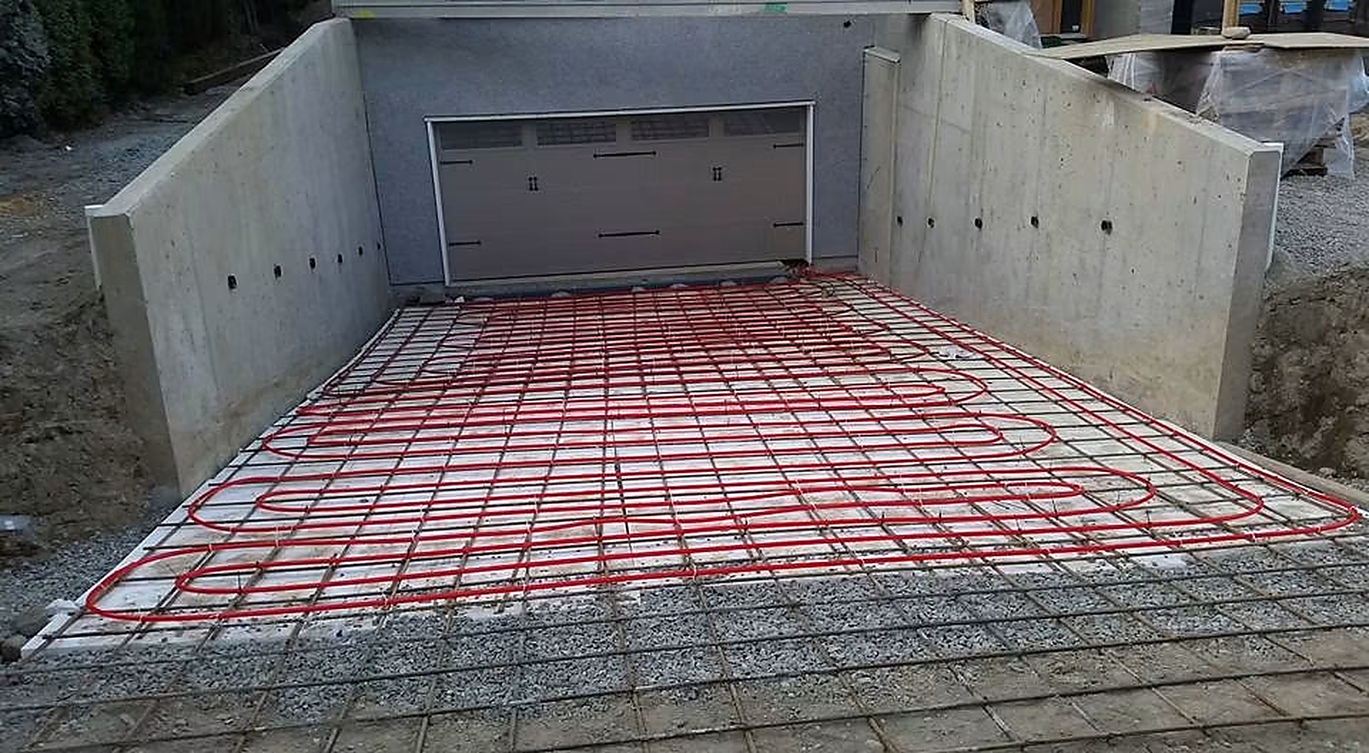 Driveway Snowmelt System — PEX snowmelt loops tied to rebar before the concrete pour.