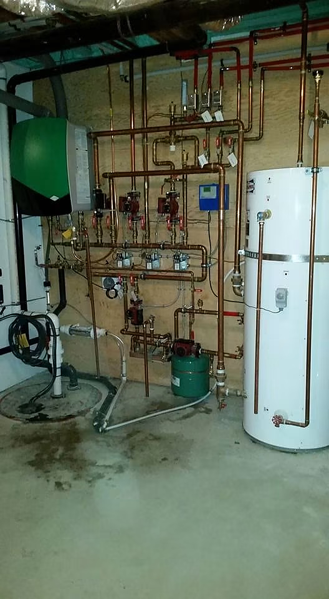 Hydronic Boiler Room — Copper-piped multi-zone boiler system with indirect hot water tank.